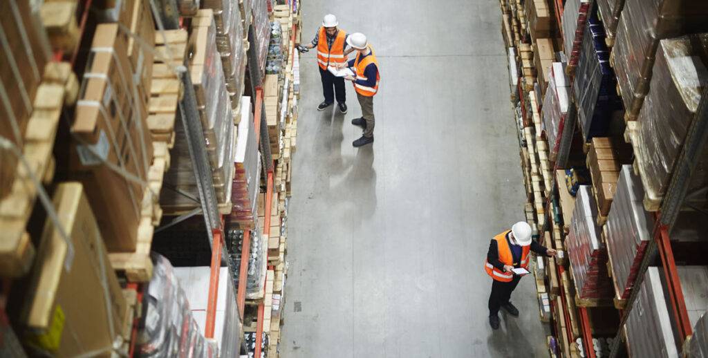 Workers-managing-inventory-in-warehouse